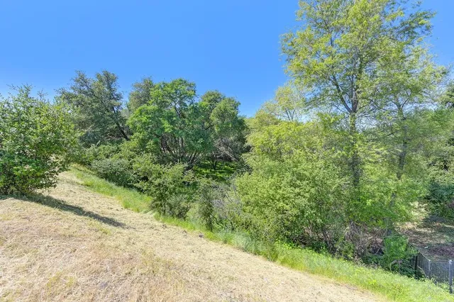 an aerial view of a house with a garden