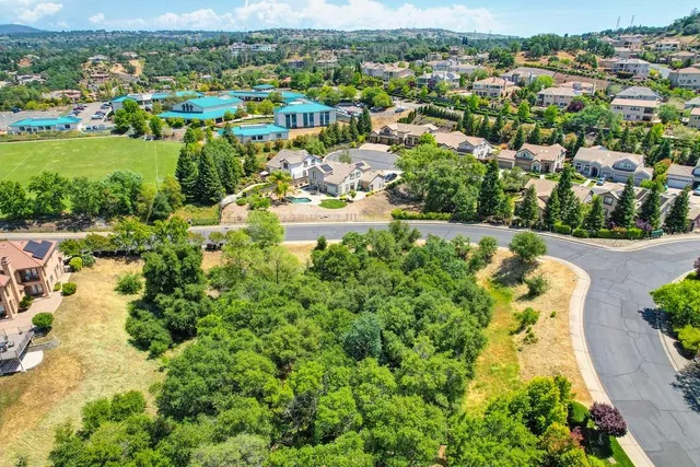 a view of a swimming pool with a yard