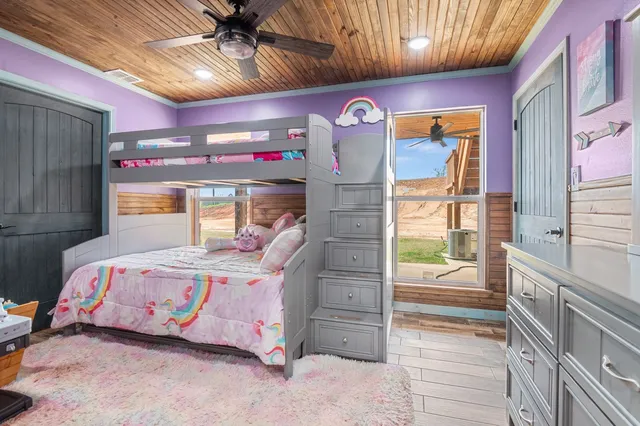 a bedroom with furniture and a window