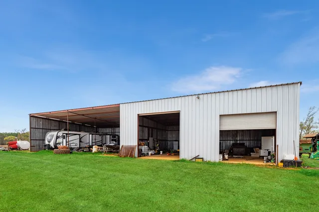 a view of a house with a yard and deck