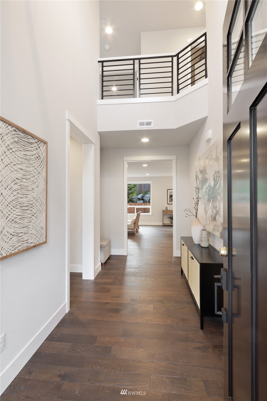 1228 197th Place Southeast Bothell, WA 98012 - Photo 15 of 34 a view of a hallway view with living room and furniture