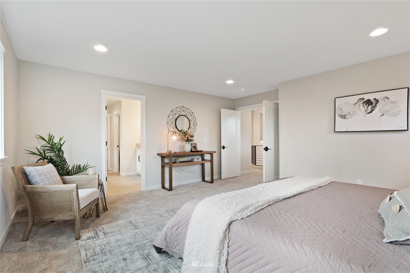 1228 197th Place Southeast Bothell, WA 98012 - Photo 19 of 34 a bedroom with a bed and a chair