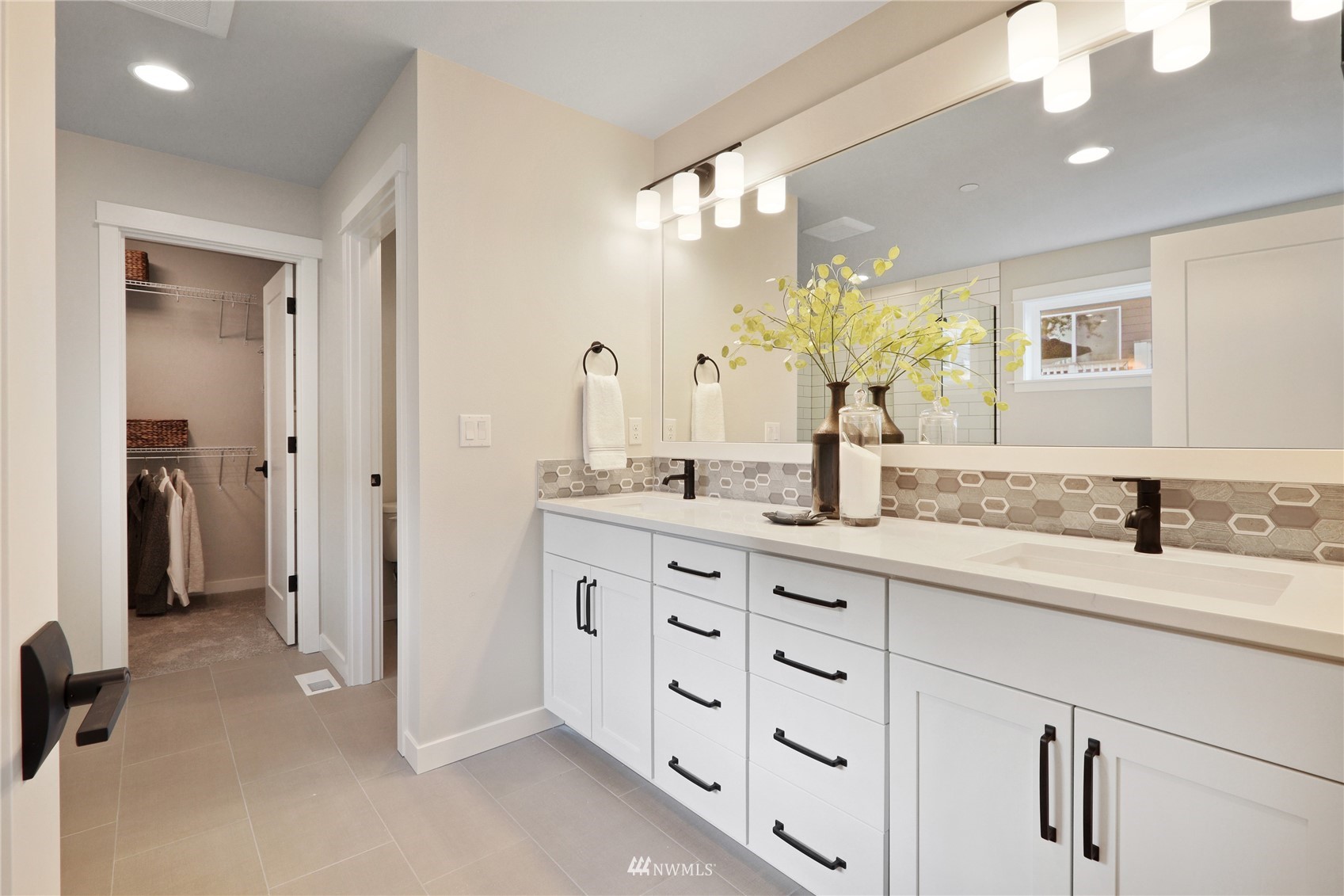 1228 197th Place Southeast Bothell, WA 98012 - Photo 22 of 34 a bathroom with a granite countertop sink mirror and a shower