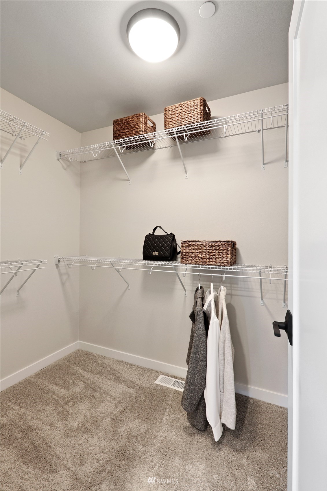1228 197th Place Southeast Bothell, WA 98012 - Photo 23 of 34 a view of a room with racks on the wall