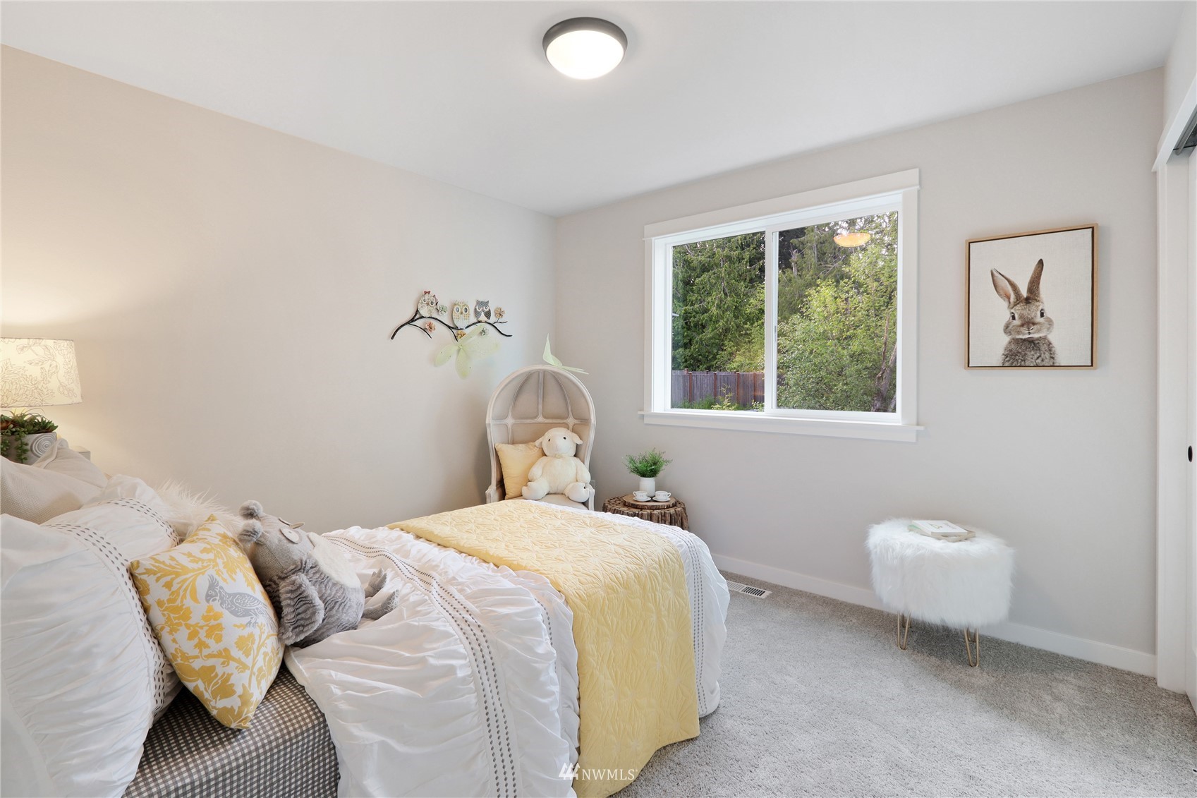 1228 197th Place Southeast Bothell, WA 98012 - Photo 24 of 34 a bedroom with a bed and a window