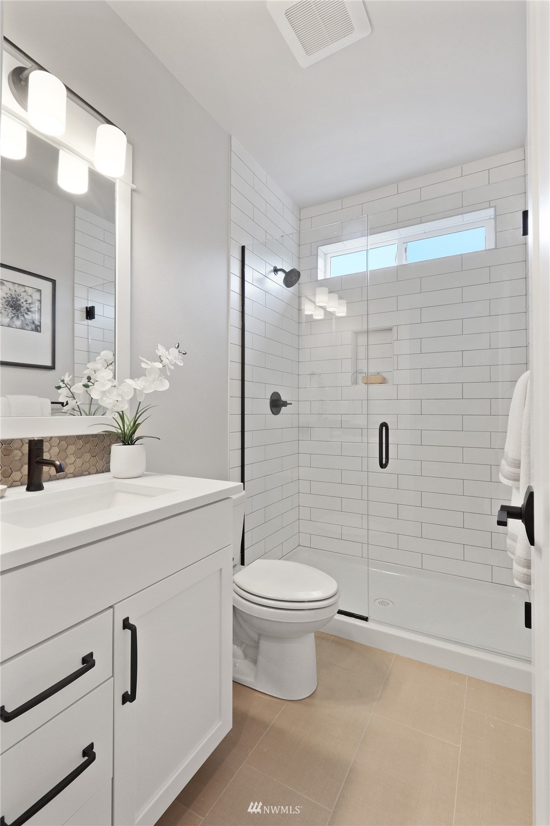 1228 197th Place Southeast Bothell, WA 98012 - Photo 27 of 34 a bathroom with a sink a toilet and shower