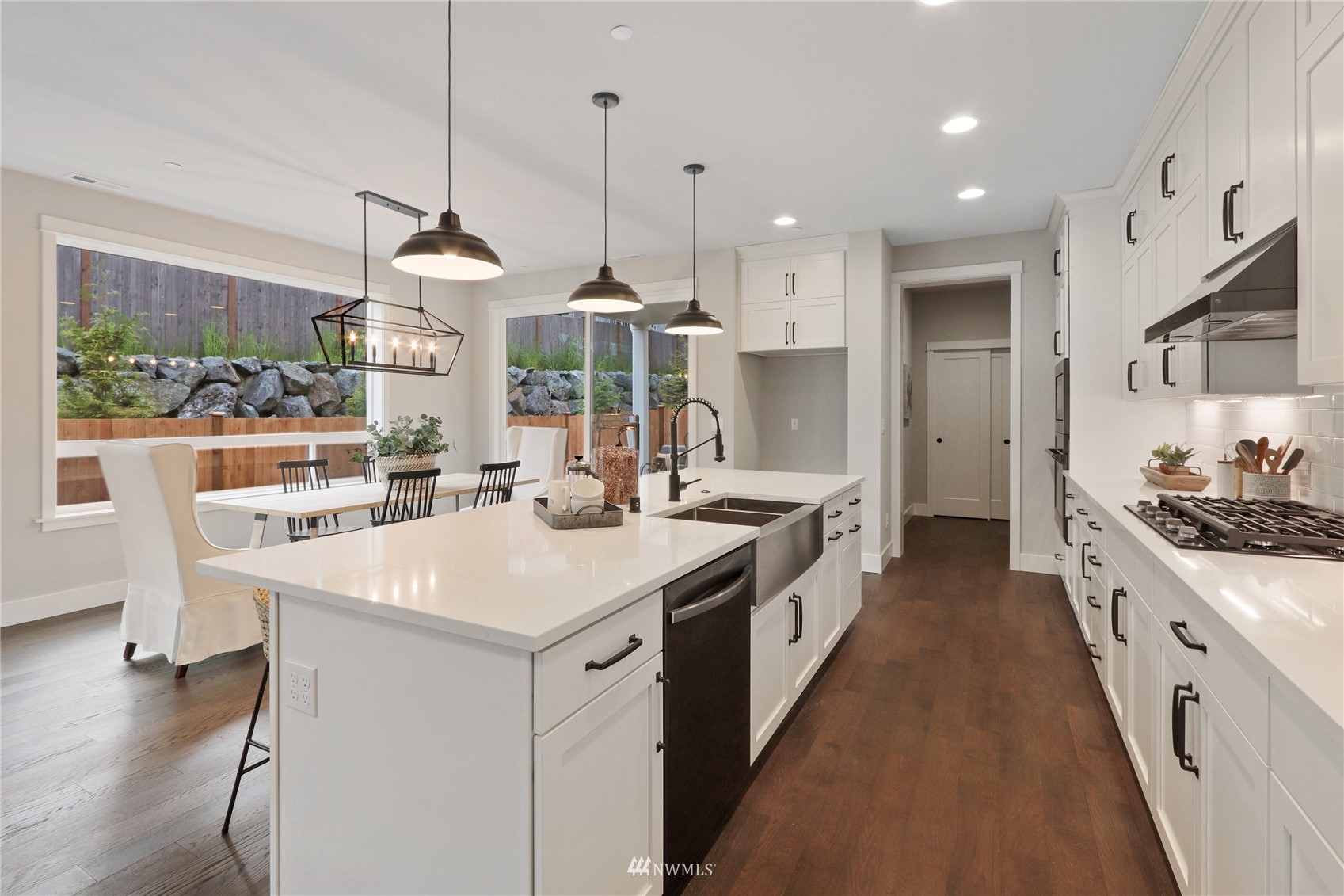 1228 197th Place Southeast Bothell, WA 98012 - Photo 5 of 34 a large kitchen with stainless steel appliances kitchen island a large island in the center