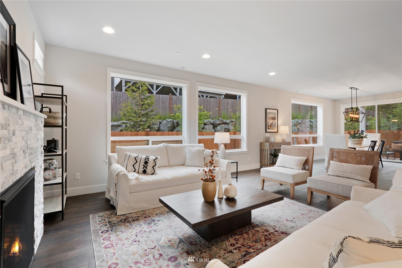 1228 197th Place Southeast Bothell, WA 98012 - Photo 10 of 34 a living room with furniture and large windows