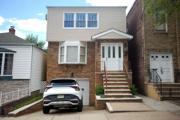 a car parked in front of a house