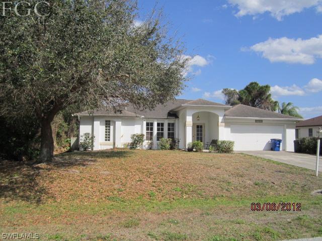 17533 Ingram Road Fort Myers, FL 33967 - Photo 1 of 9 a front view of a house with a yard