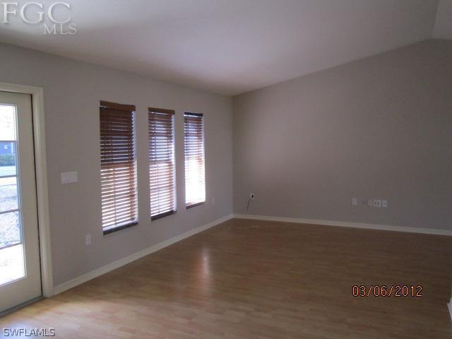 17533 Ingram Road Fort Myers, FL 33967 - Photo 2 of 9 an empty room with a window