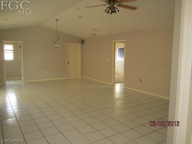 17533 Ingram Road Fort Myers, FL 33967 - Photo 4 of 9 an empty room with a door