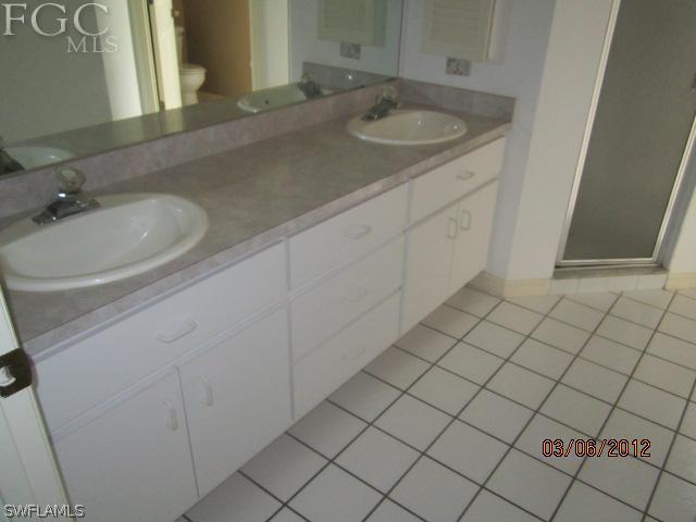 17533 Ingram Road Fort Myers, FL 33967 - Photo 8 of 9 a bathroom with a sink and a mirror