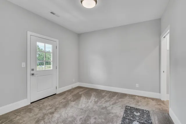 a bathroom with a bathtub and a toilet