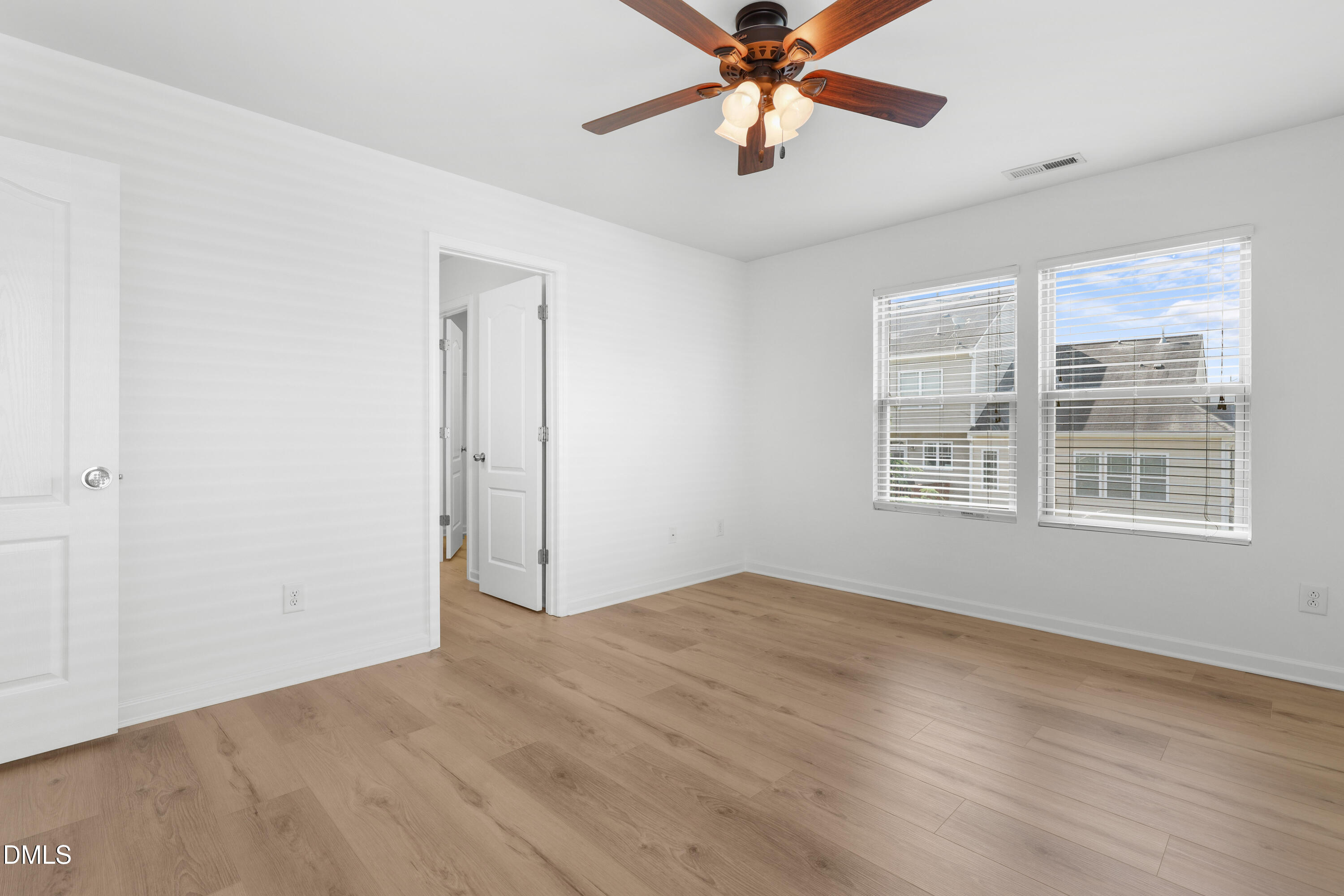 4400 Hillsgrove Road Wake Forest, NC 27587 - Photo 21 of 49 an empty room with windows and fan
