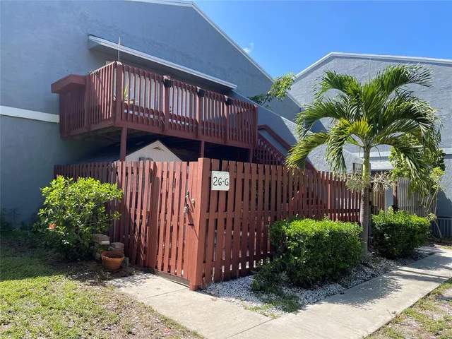 a view of a backyard with potted plants