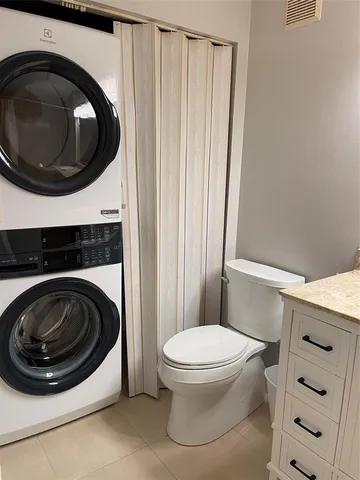 a bathroom with a toilet and a sink