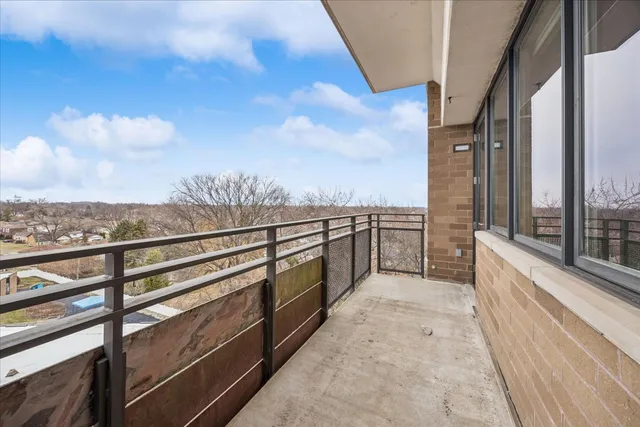 a view of a balcony with furniture
