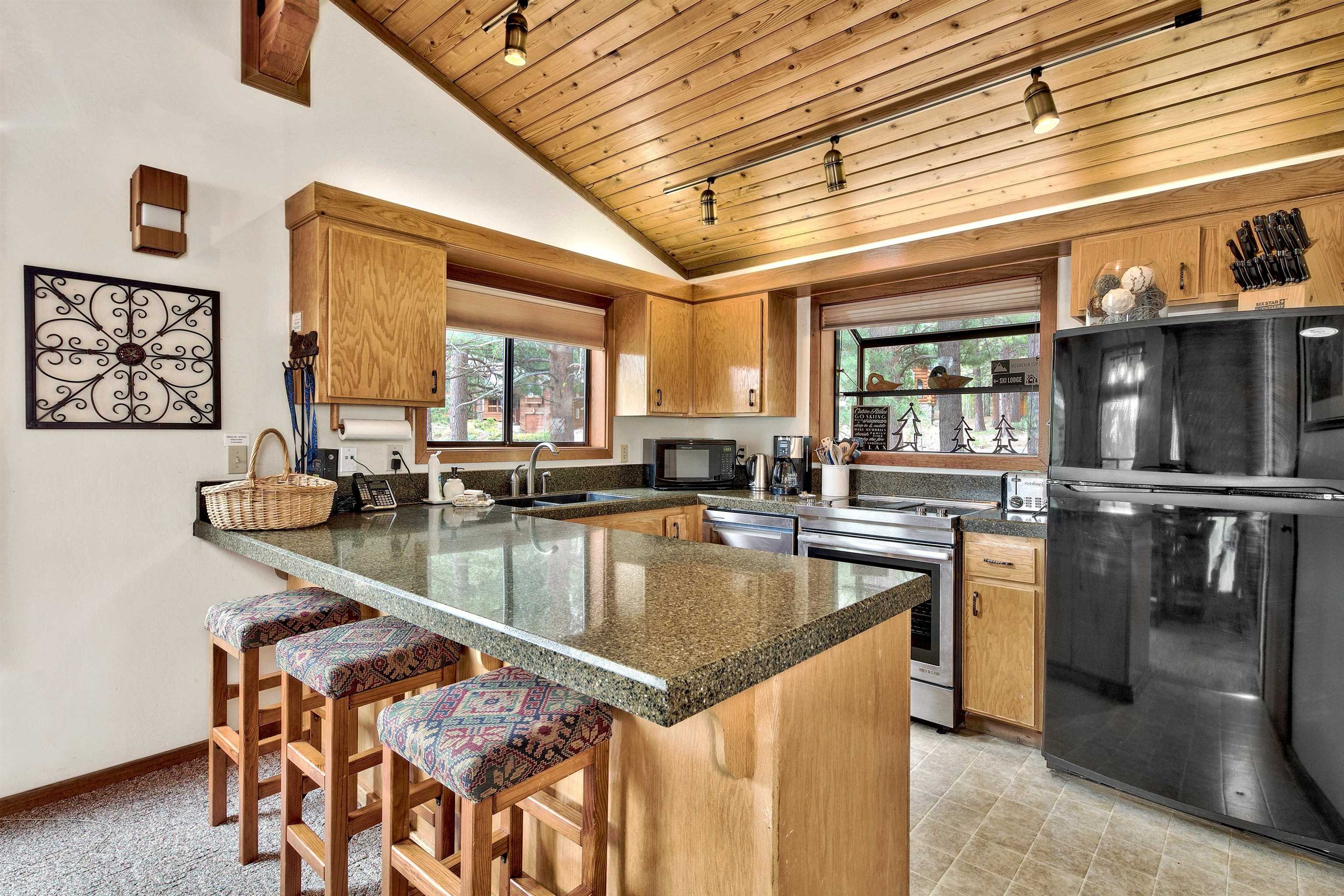 253 Basque Drive, Unit SHARE #2 Truckee, CA 96161 - Photo 17 of 24 a kitchen with stainless steel appliances granite countertop a sink a counter top space and stainless steel appliances