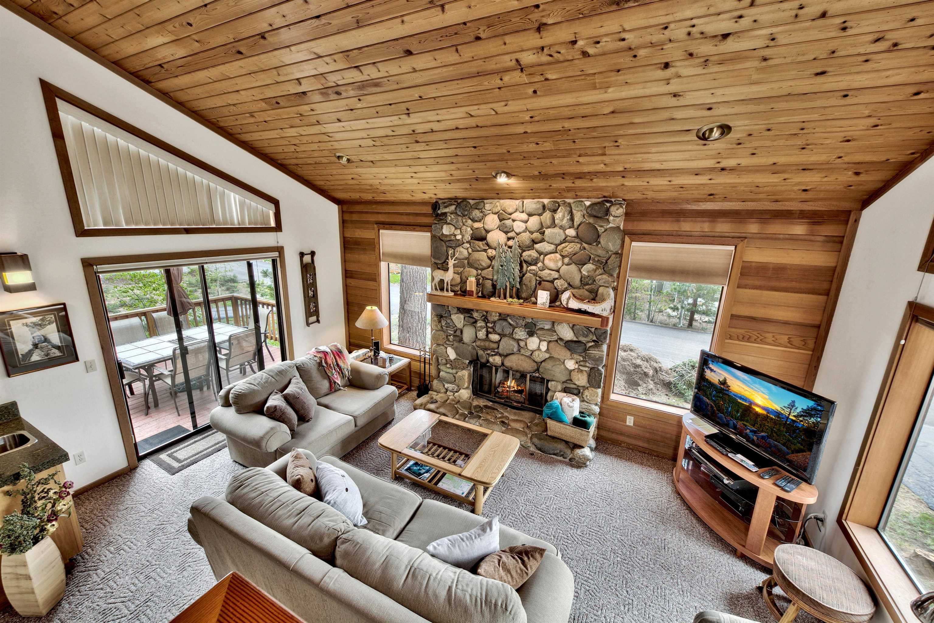 253 Basque Drive, Unit SHARE #2 Truckee, CA 96161 - Photo 4 of 24 a living room with furniture and a flat screen tv
