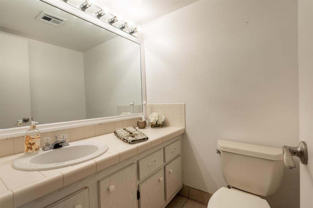 22605 Southwest 66th Avenue, Unit 102 Boca Raton, FL 33428 - Photo 11 of 27 a bathroom with a sink and a toilet