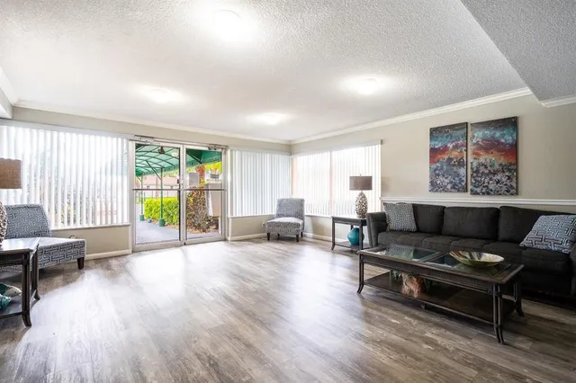 a view of a swimming pool with a patio
