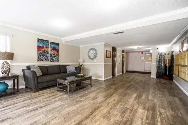 a kitchen with a sink cabinets and white appliances