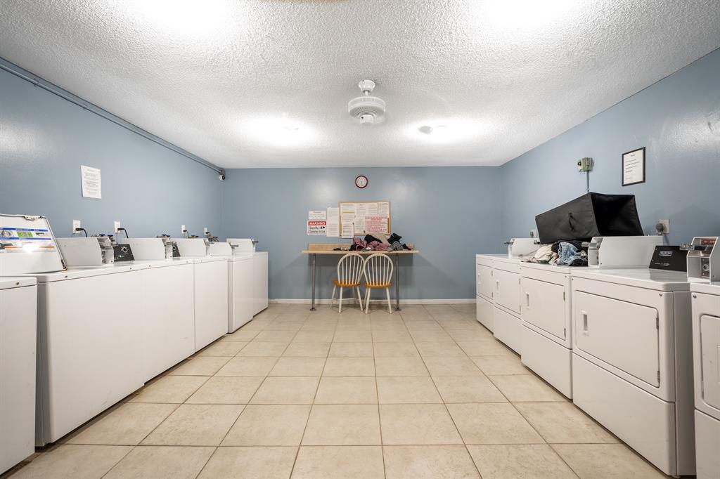 22605 Southwest 66th Avenue, Unit 102 Boca Raton, FL 33428 - Photo 24 of 27 a kitchen with a sink cabinets and white appliances
