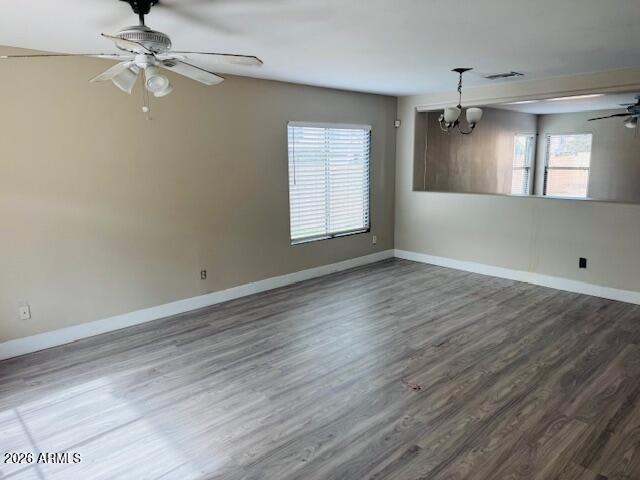 43724 West Cowpath Road Maricopa, AZ 85138 - Photo 11 of 21 wooden floor in an empty room with a window