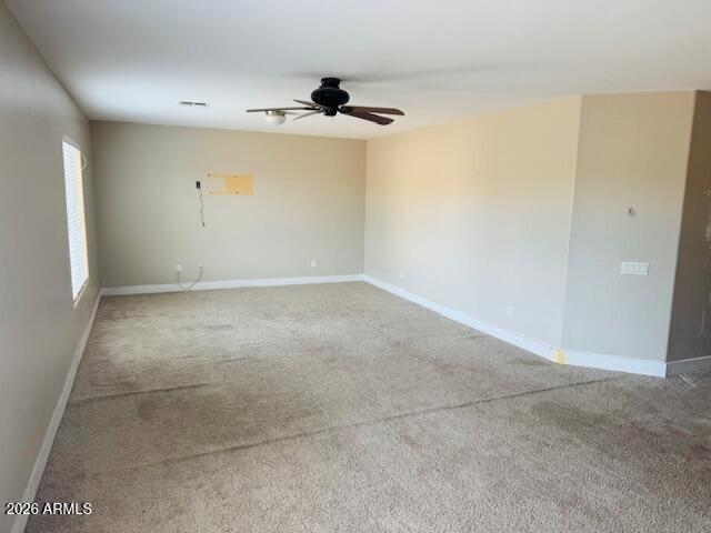 43724 West Cowpath Road Maricopa, AZ 85138 - Photo 14 of 21 an empty room with a empty space and a ceiling fan