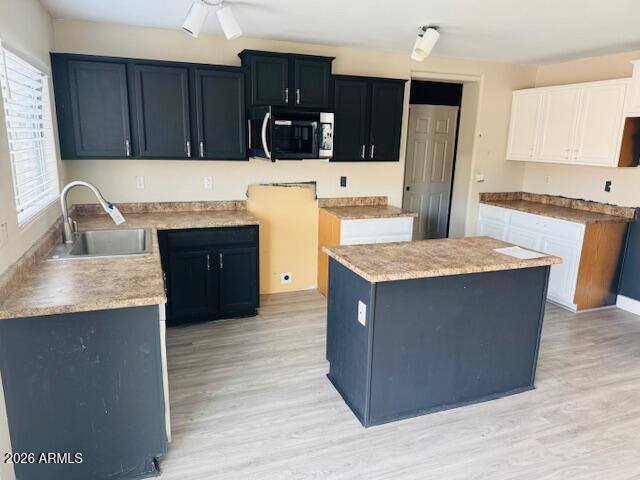43724 West Cowpath Road Maricopa, AZ 85138 - Photo 3 of 21 a kitchen with stainless steel appliances granite countertop a stove a refrigerator a sink a oven and wooden cabinets