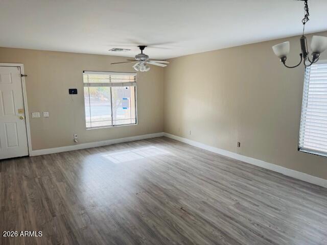 43724 West Cowpath Road Maricopa, AZ 85138 - Photo 10 of 21 wooden floor in an empty room with a window