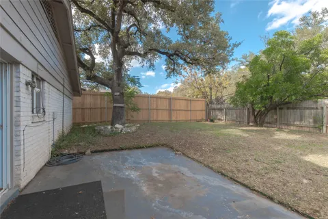 a backyard of a house with lots of green space