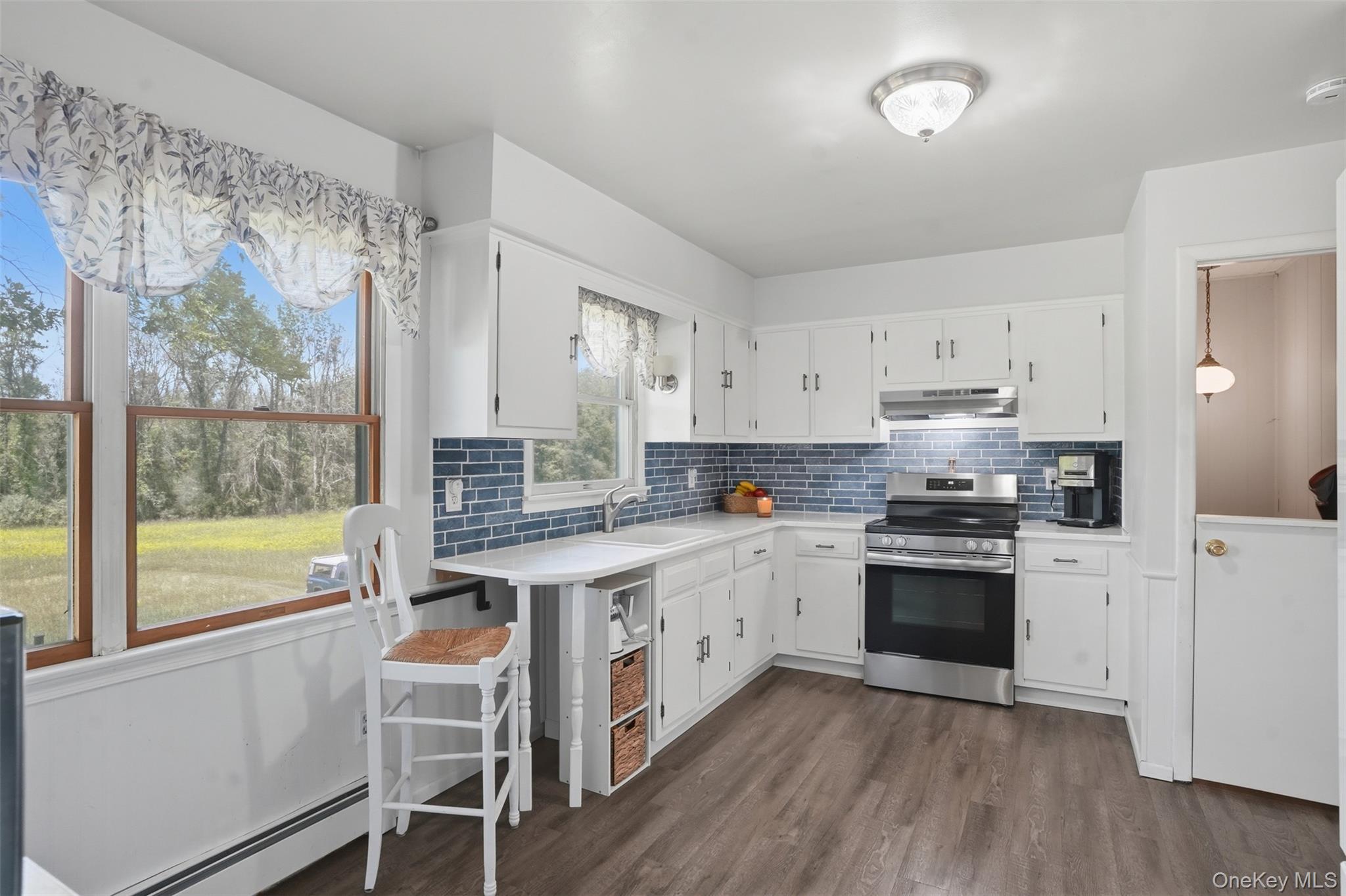 23 Old Cross Road Warwick, NY 10990 - Photo 11 of 34 Recently refreshed, your kitchen has quartz counters, glass tile backsplash, newer appliances, and timeless white cabinetry.