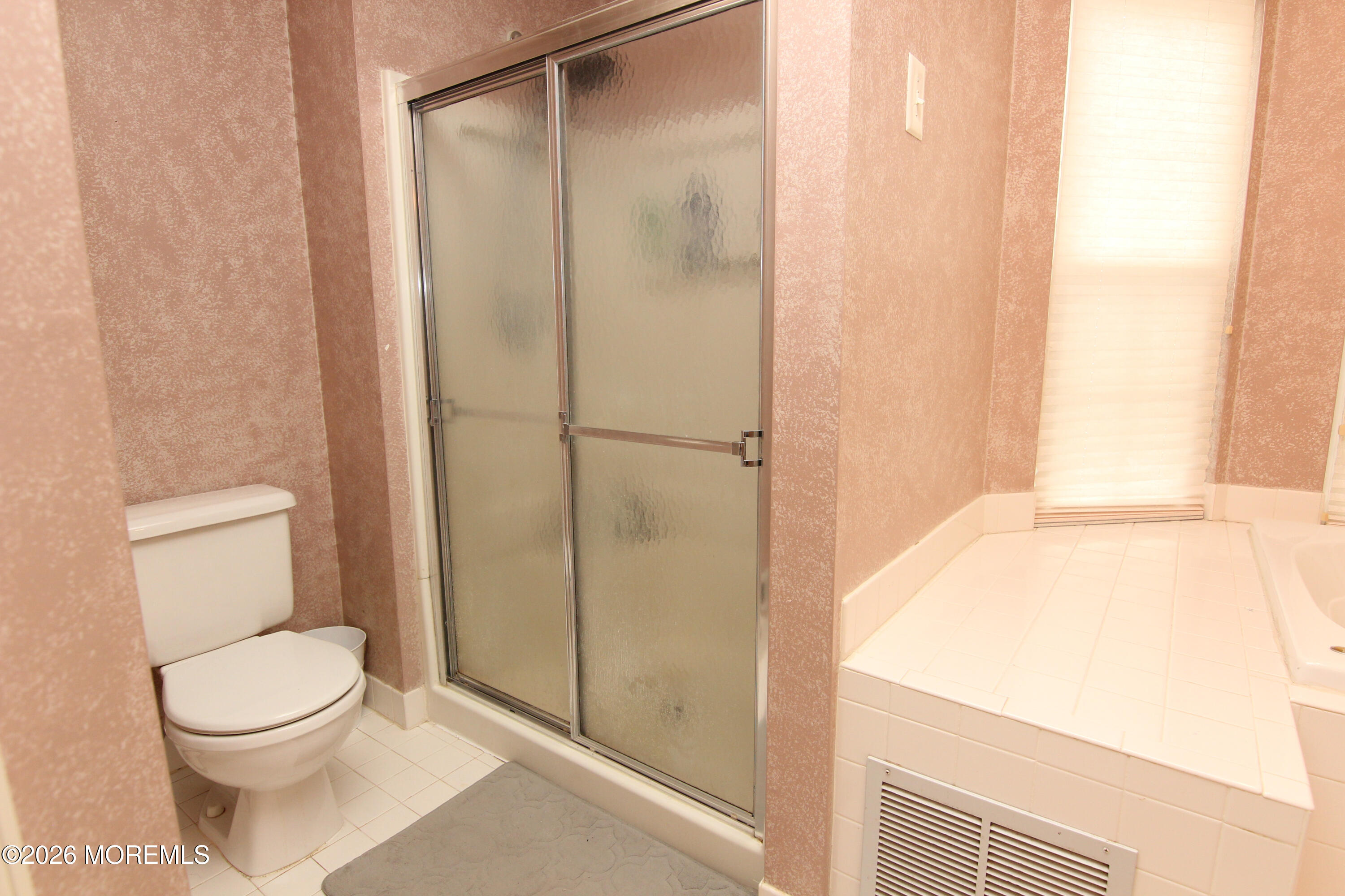 33 Austin Street Tinton Falls, NJ 07712 - Photo 12 of 46 a bathroom with a toilet and a shower