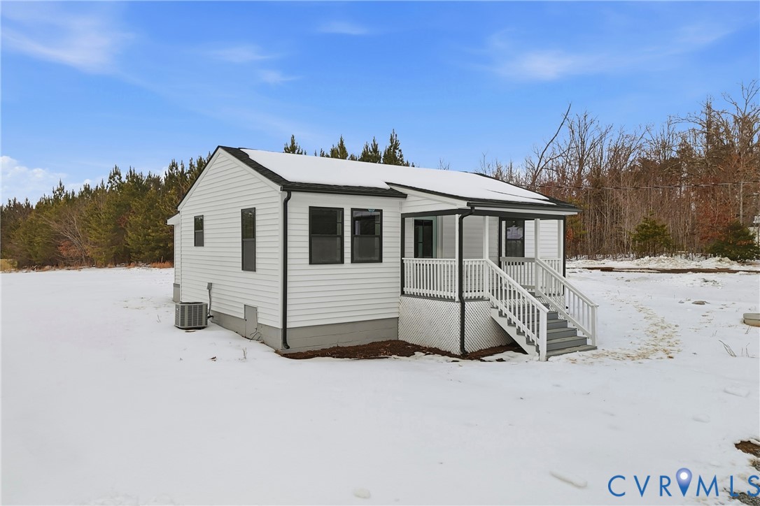 a view of a white house with a yard