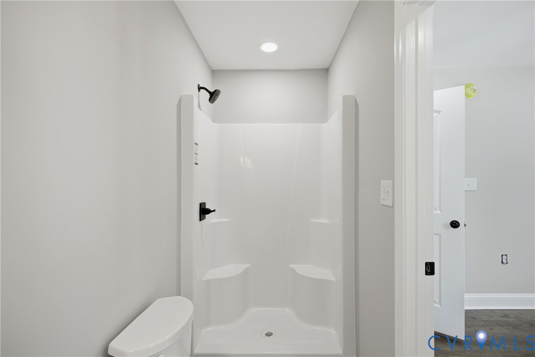 7625 Venable Road Kents Store, VA 23084 - Photo 16 of 31 a bathroom with a shower a toilet and a sink