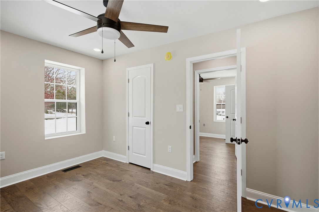 7625 Venable Road Kents Store, VA 23084 - Photo 18 of 31 wooden floor in an empty room with a window