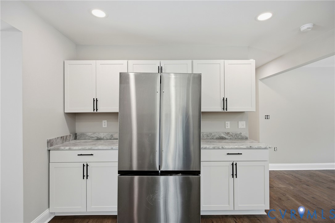 7625 Venable Road Kents Store, VA 23084 - Photo 9 of 31 a kitchen with a refrigerator sink and cabinets