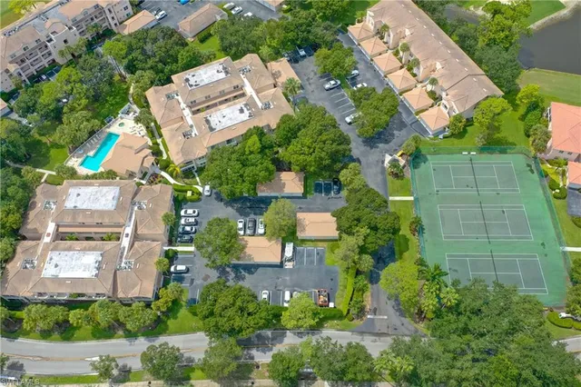 an aerial view of a house with a yard and plants