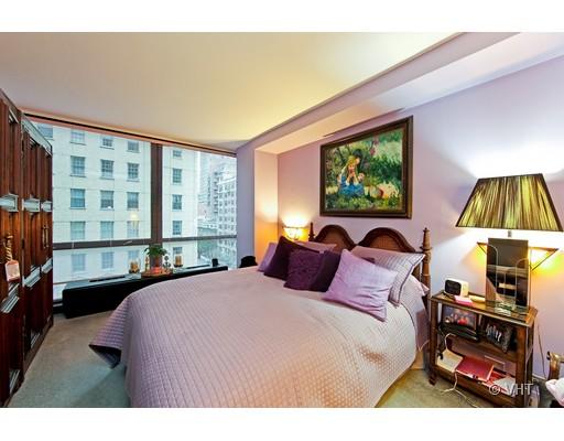 910 North Lake Shore Drive, Unit 718 Chicago, IL 60611 - Photo 7 of 10 a bedroom with a bed a window and dresser