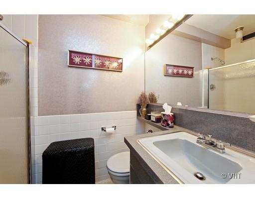910 North Lake Shore Drive, Unit 718 Chicago, IL 60611 - Photo 8 of 10 a bathroom with a sink vanity mirror and toilet