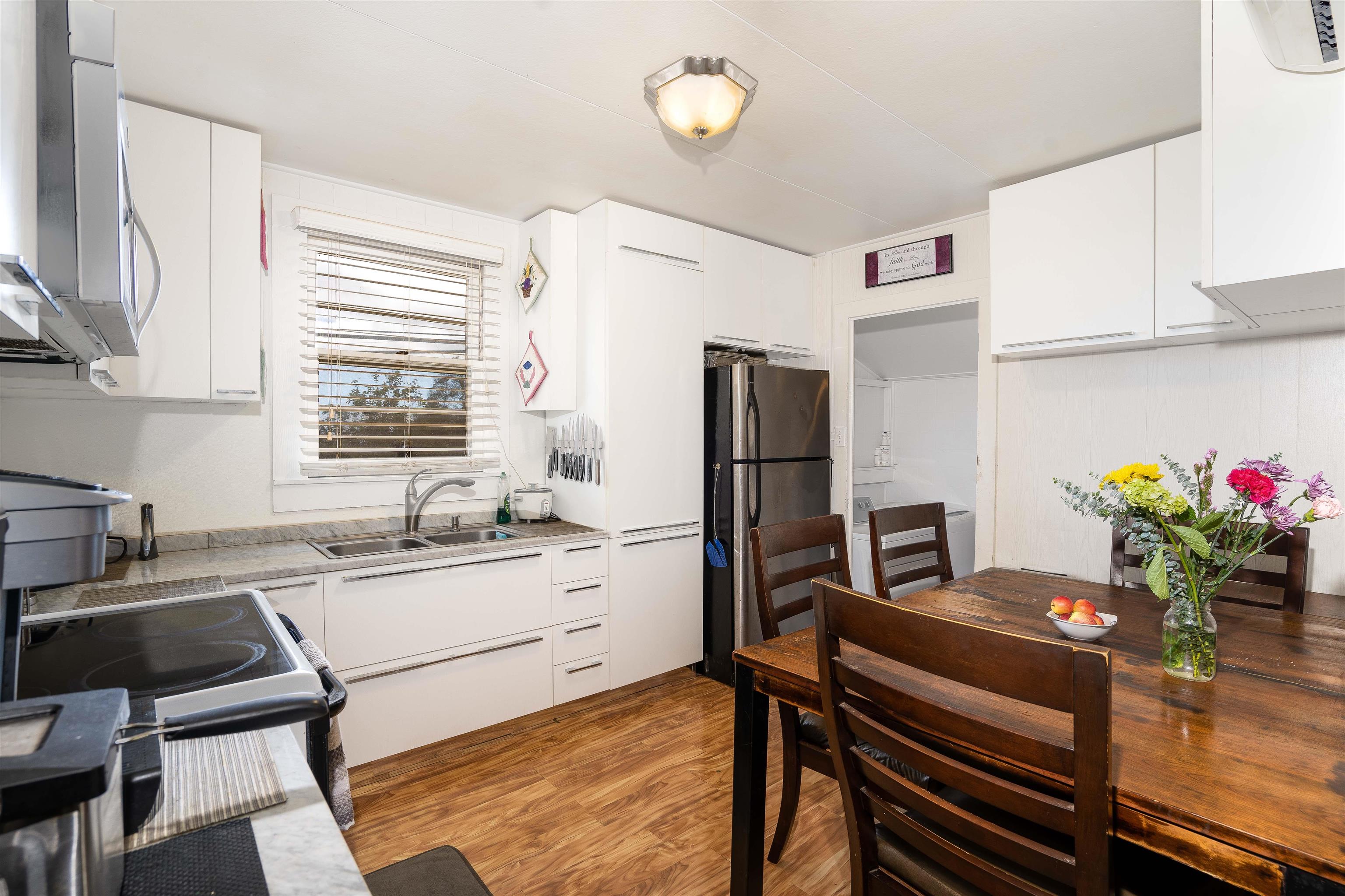 5340 Lower Kula Road Kula, HI 96790 - Photo 6 of 29 a kitchen with a refrigerator and a sink