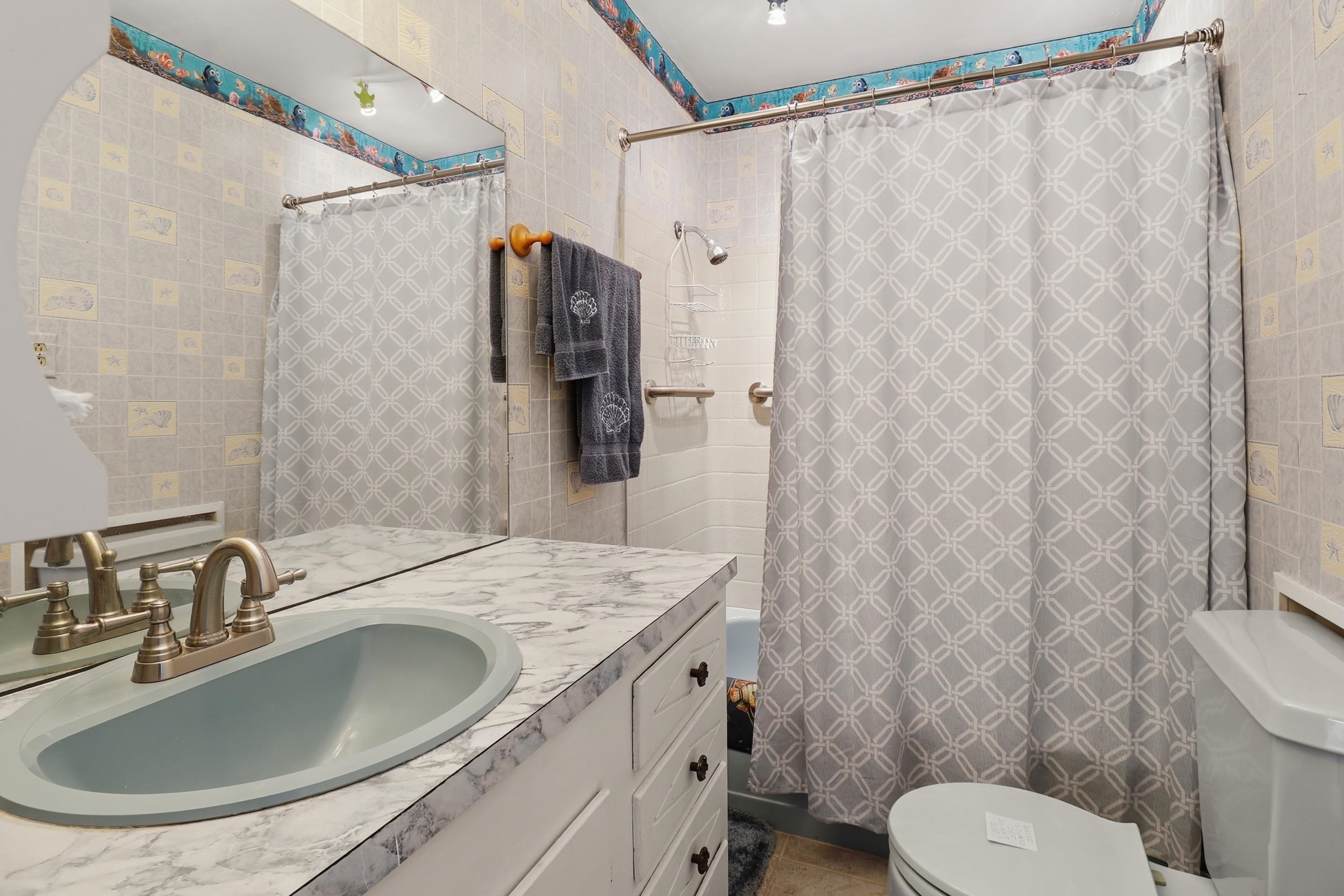 919 Lakeshore Loop Tow, TX 78672 - Photo 25 of 33 a bathroom with a sink toilet and shower