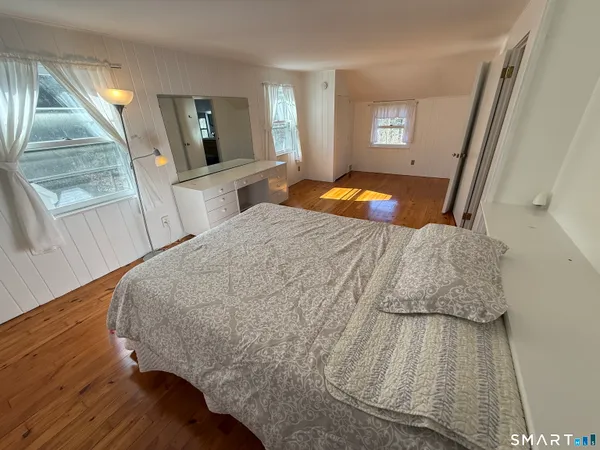 a bathroom with a double vanity sink mirror and toilet