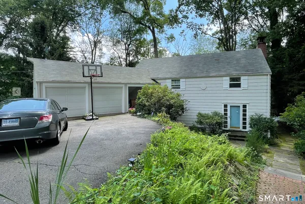 a view of a car parked in front of a house