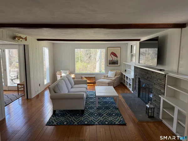 a living room with furniture and a rug