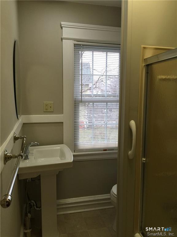 28 Grove Street Thomaston, CT 06787 - Photo 10 of 10 a bathroom with a sink and a mirror