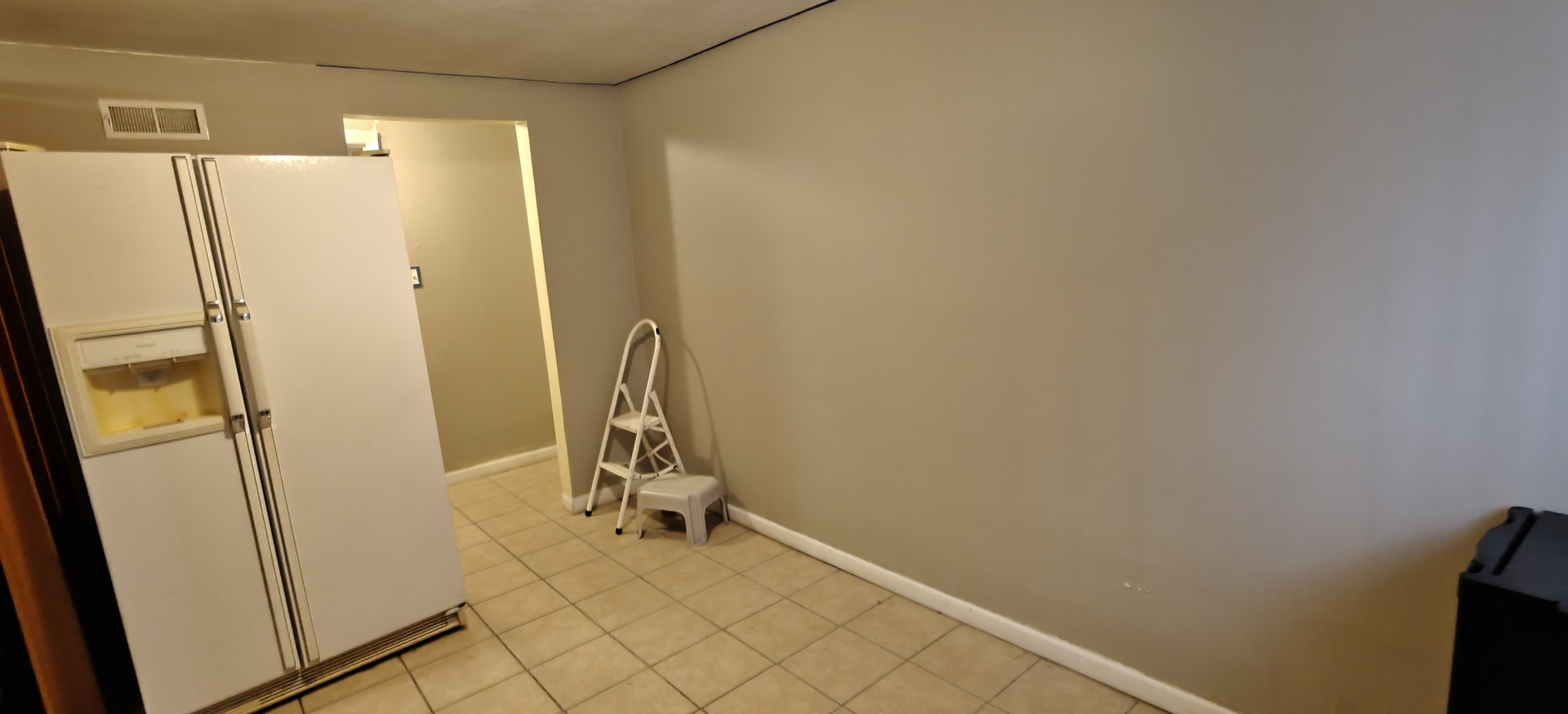 4515 Raven Street Rockford, IL 61107 - Photo 18 of 22 a view of a storage & utility room with a refrigerator