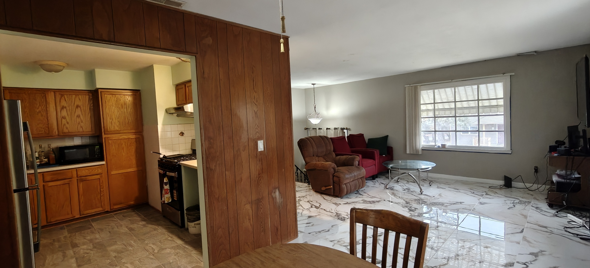 4515 Raven Street Rockford, IL 61107 - Photo 7 of 22 a living room with furniture windows and a flat screen tv